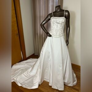 Elegant White Strapless Wedding Dress with satin cathedral length train.